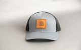 light blue ball cap with Southern Trust logo patch